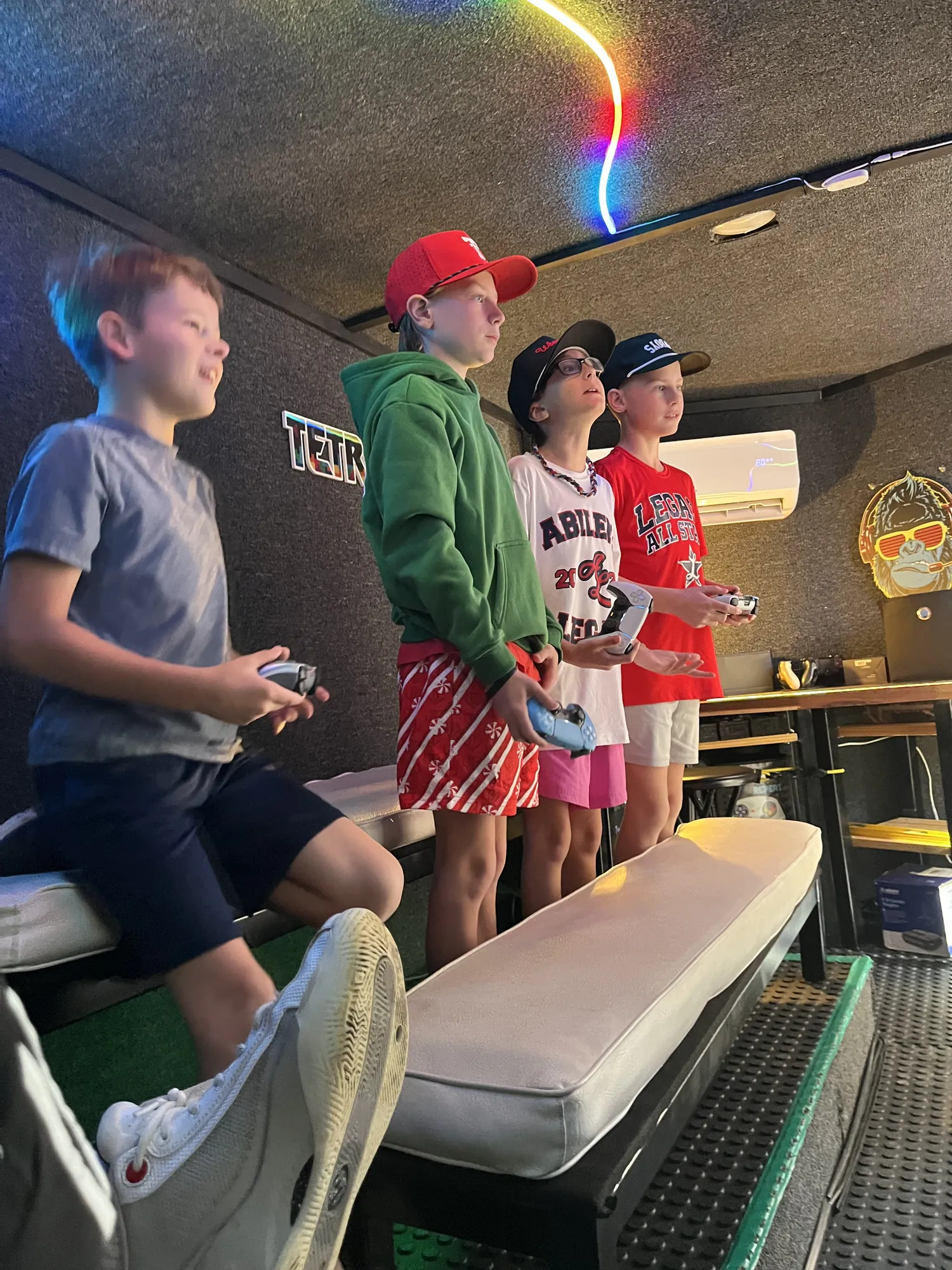 Tweens standing up with their controllers for the final seconds of a match