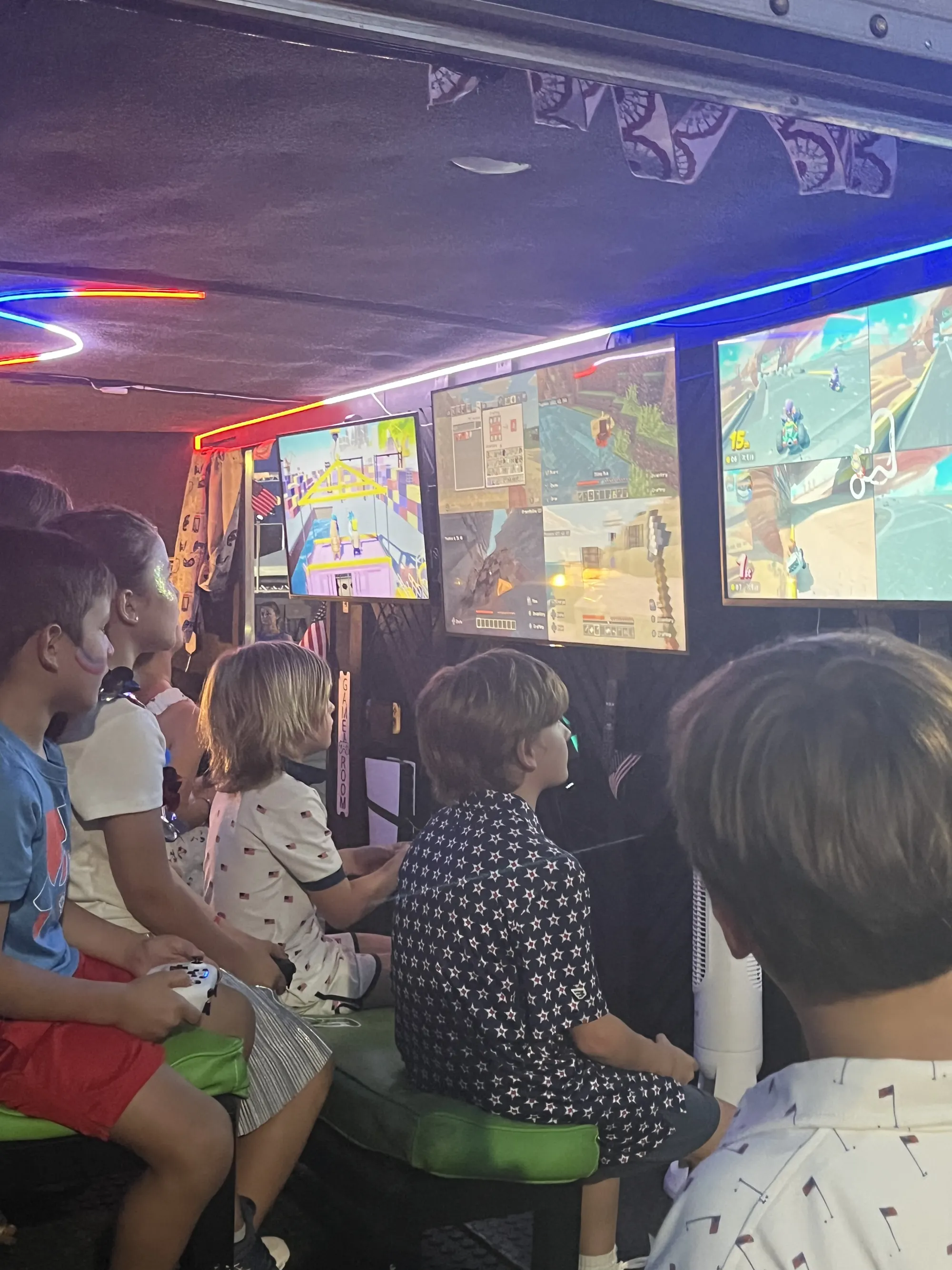 Guests playing side by side on the trailer’s big screens