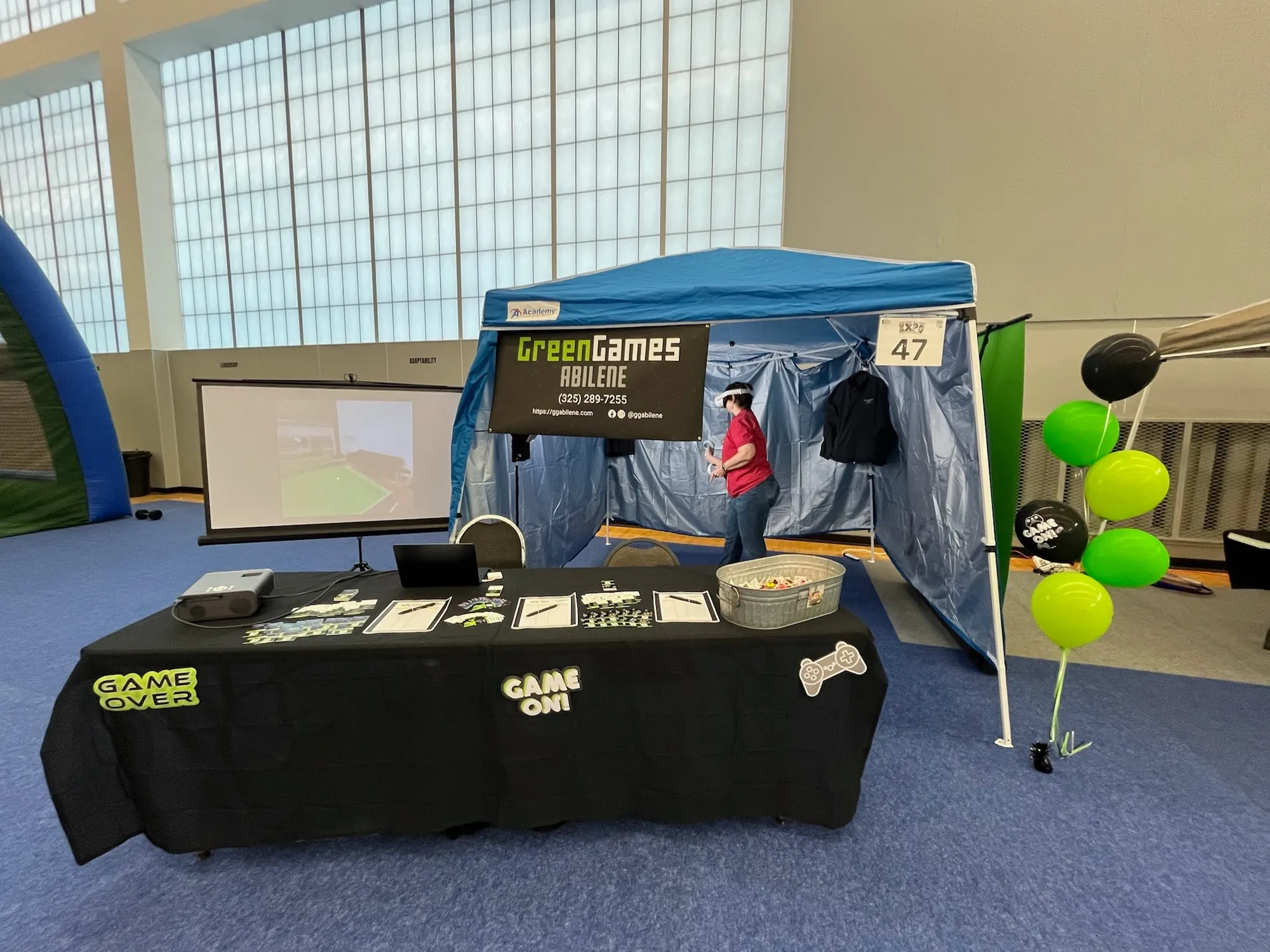 The Green Games Abilene booth with a VR play area at the AYSA expo
