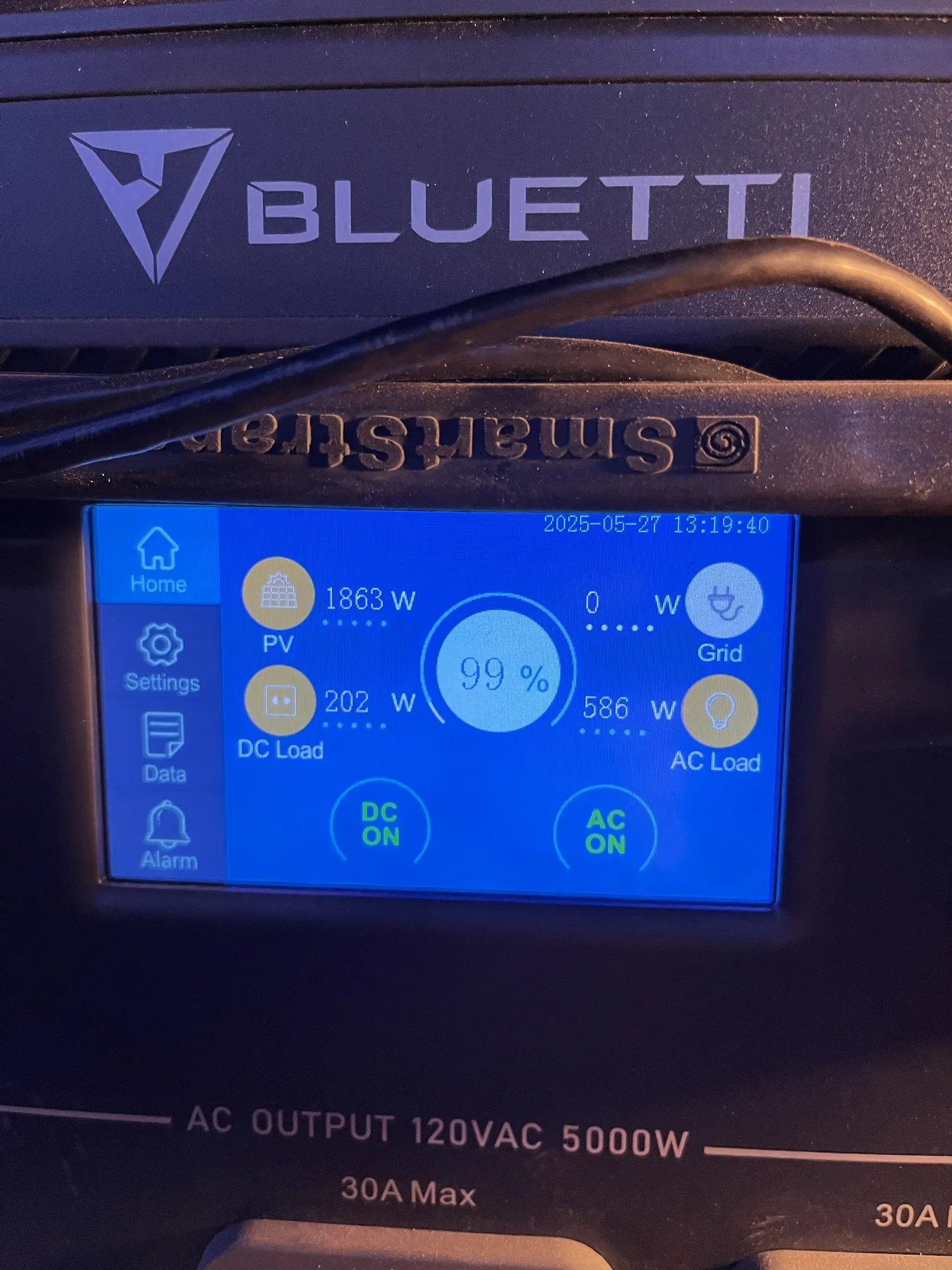 The trailer’s solar battery screen showing a 99 percent charge