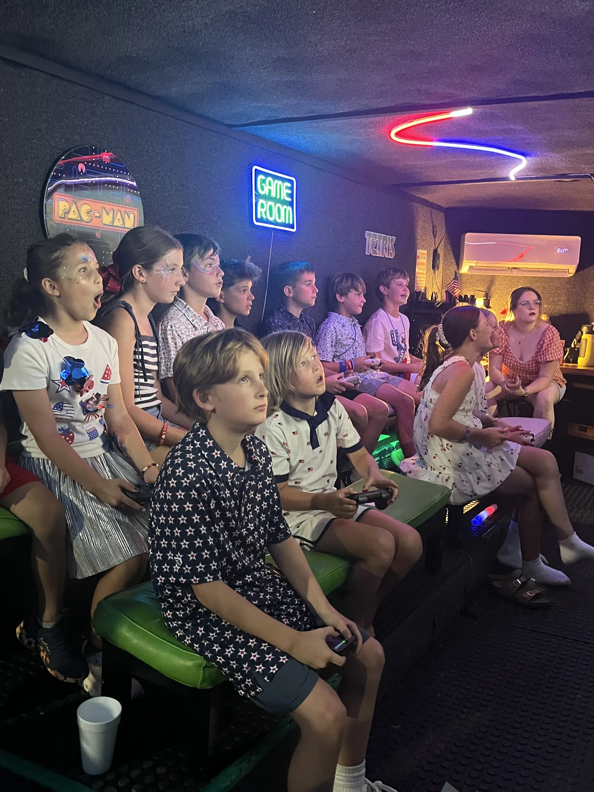 A full group of guests sharing a gaming party