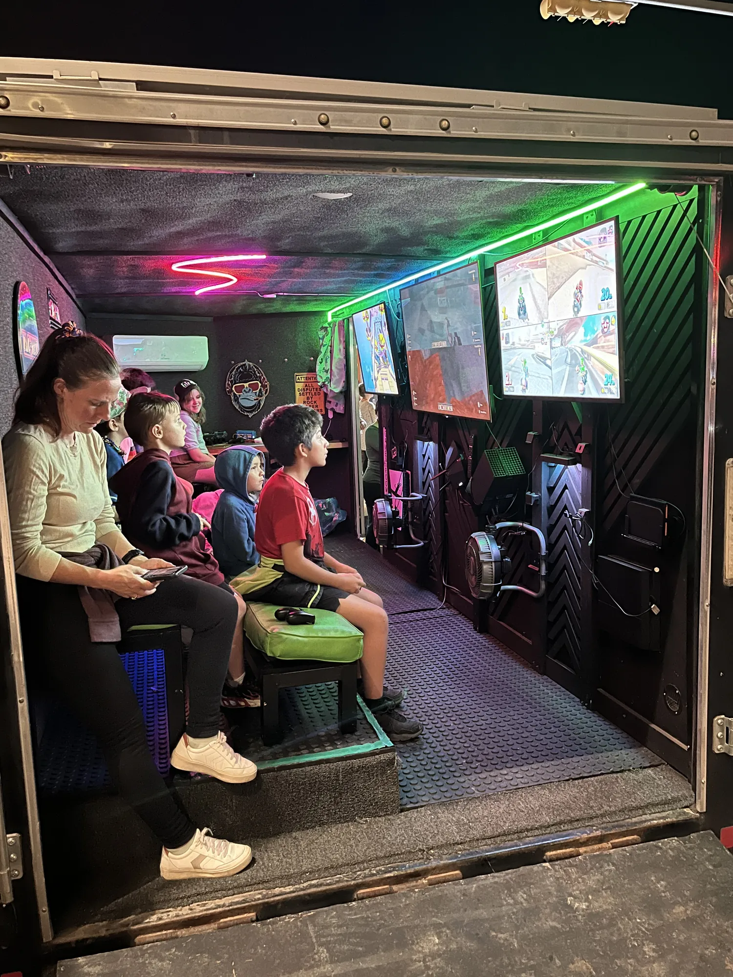 Every seat filled with players inside the trailer at night