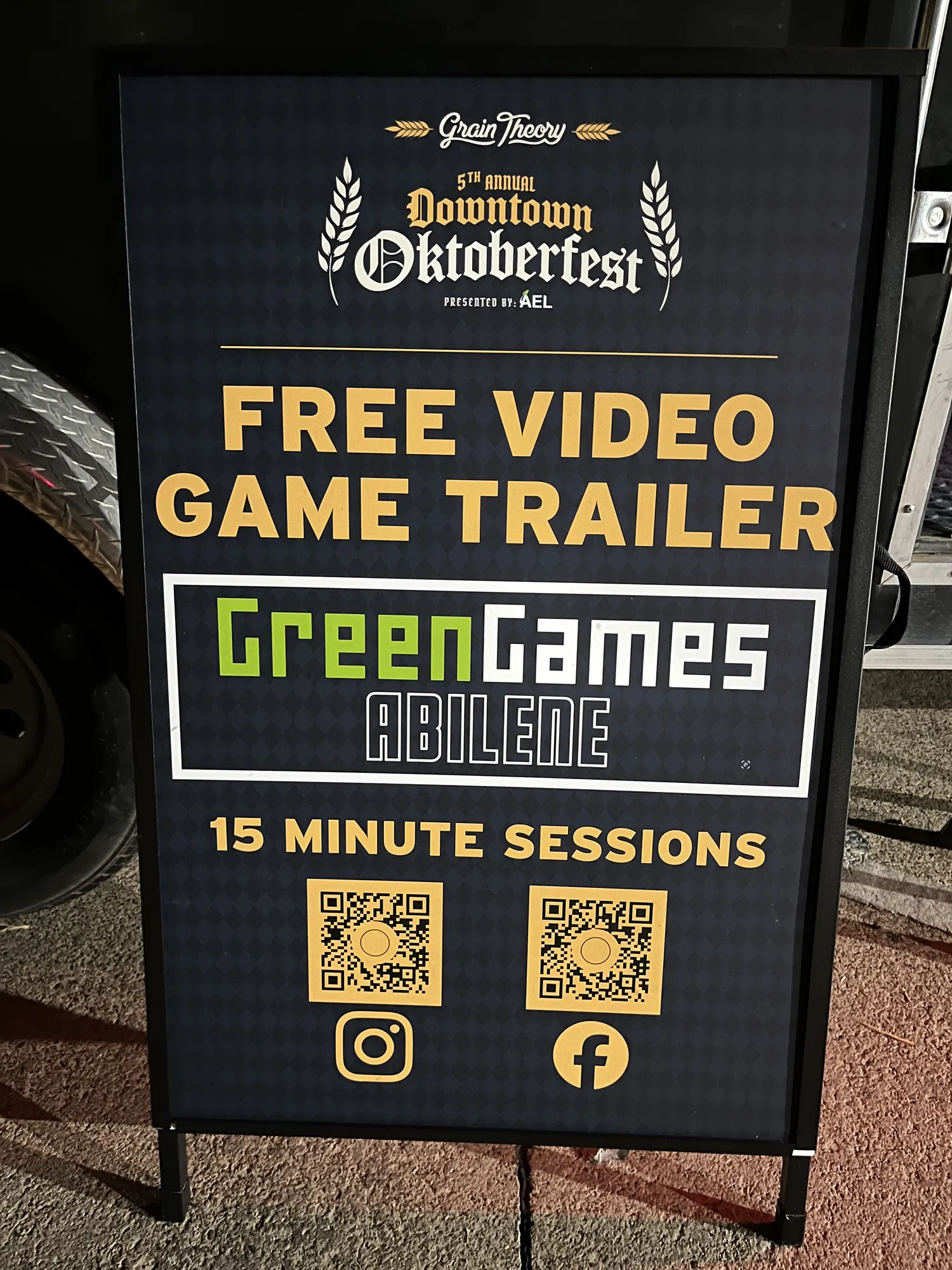 The Green Games sign by the trailer late in the evening