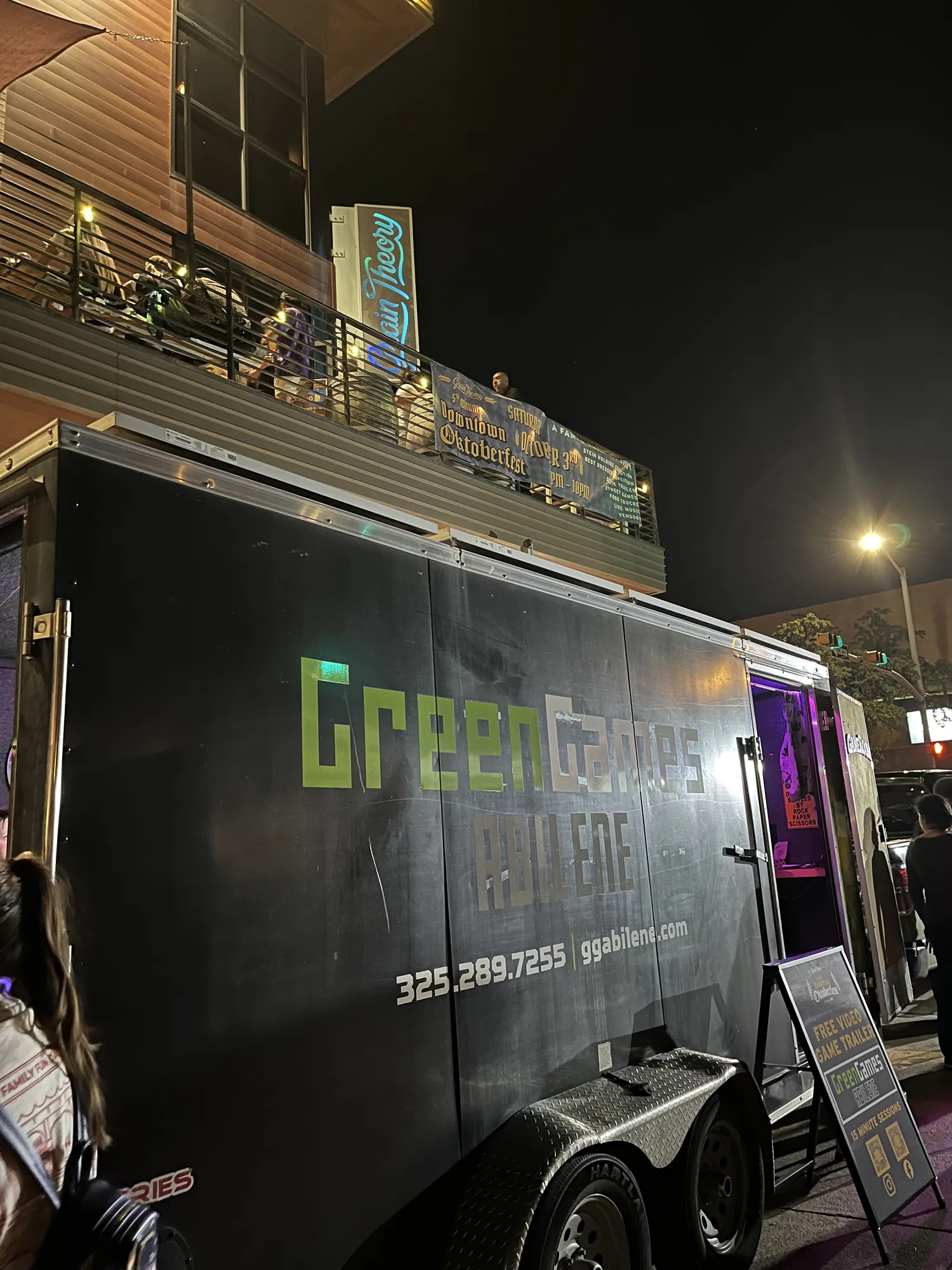 The Green Games trailer parked downtown at night