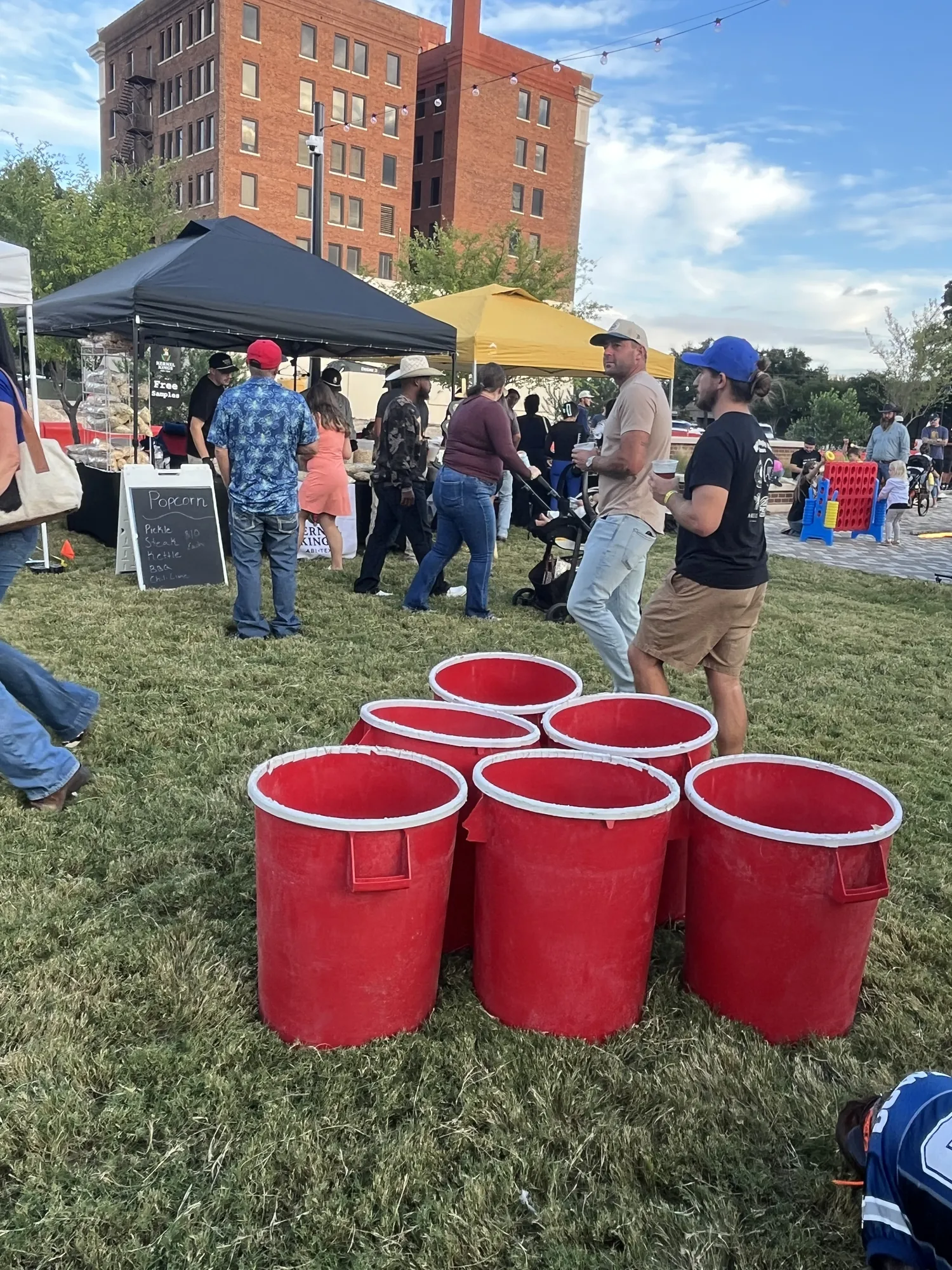 Giant red cups set up for yard games on the lawn