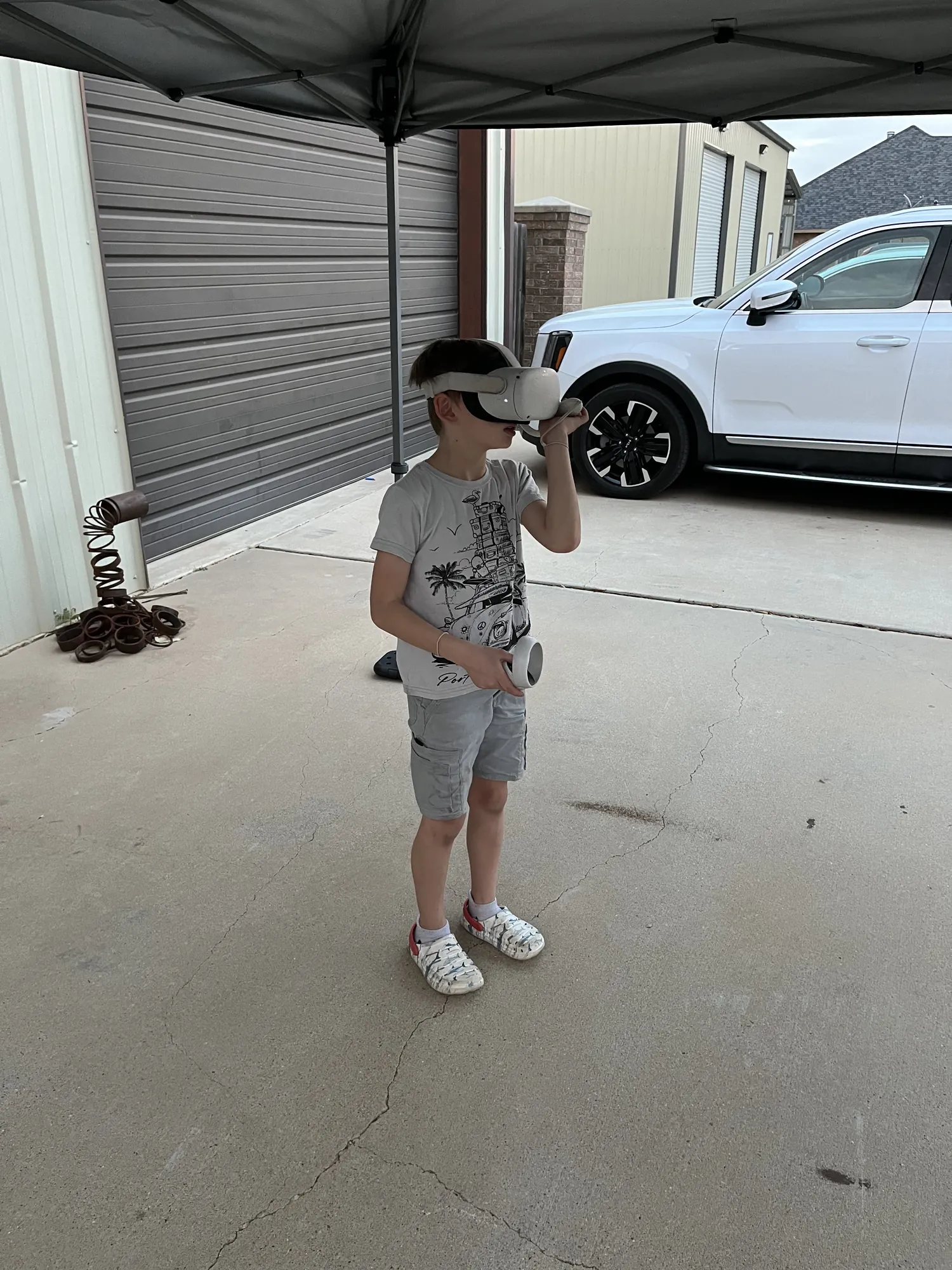 A young player adjusting his VR headset